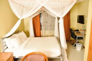 Wagon Wheel Hotel Eldoret客房内的一张或多张床位