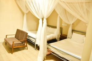 Wagon Wheel Hotel Eldoret客房内的一张或多张床位
