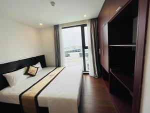 Rúm í herbergi á Danang Classic Hotel