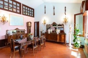 a dining room with a table and chairs at Casa Acropoli Sea View Taormina Center in Taormina