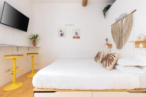 En eller flere senge i et værelse på Cantoni 4B - Studio at Colosseum