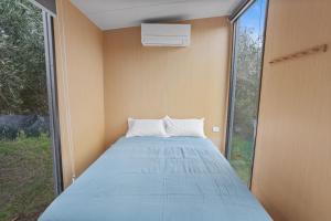Voodi või voodid majutusasutuse Scrub Tiny House by Tiny Away toas
