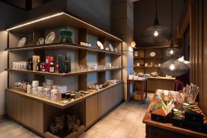 a room with shelves with products on them at Glamday Style Okinawa Yomitan Hotel & Resort in Yomitan
