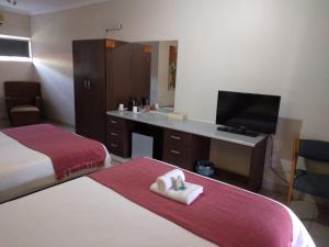 Oasis Hotel客房内的一张或多张床位