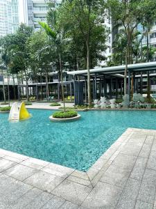 a swimming pool in a city with a building at AGH-Medini Signature轻奢温馨风-3分钟乐高乐园-儿童游戏角落-儿童亲善-9pax in Nusajaya