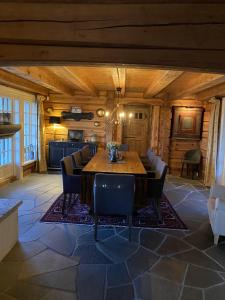 a large dining room with a table and chairs at Cozy family cabin with stunning location on Golsfjellet in Golsfjellet +48 photos