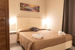 Postel nebo postele na pokoji v ubytování Golden Milano Hotel