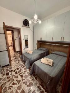 Ένα ή περισσότερα κρεβάτια σε δωμάτιο στο De Giovanni's House