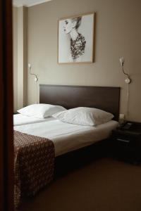 Postel nebo postele na pokoji v ubytování Hotel Liburnia