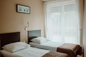 Postel nebo postele na pokoji v ubytování Hotel Liburnia