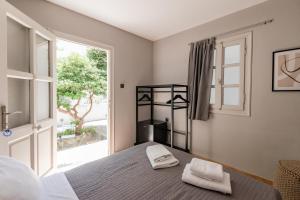 Кровать или кровати в номере Rania Apartments Sea View +170 фотографий