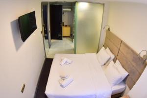 TV a/nebo společenská místnost v ubytování Taksim Hotel V Plus