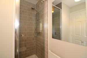 a bathroom with a shower and a mirror at Signature - Morrison House in Glasgow +40 photos