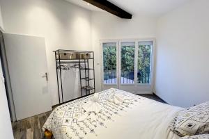 Postel nebo postele na pokoji v ubytování Haut de villa vue mer 3 pièces climatisé & wifi 4 à 6 personnes + 17 fotografií