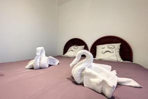 Postel nebo postele na pokoji v ubytování Haut de villa vue mer 3 pièces climatisé & wifi 4 à 6 personnes