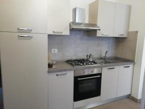 Kuchyň nebo kuchyňský kout v ubytování Melibi - Re Lear Apartments