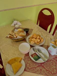 a table with plates of food on top of it at Guest house Aidyn-Kul in Toguz-Bulak +50 photos