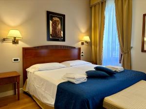 Postel nebo postele na pokoji v ubytování Locanda del Ghetto