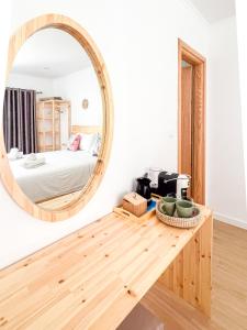 a bedroom with a bed and a mirror at Vraxlida Living in Himare +69 photos