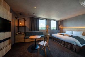 Voodi või voodid majutusasutuse hotel around TAKAYAMA, Ascend Hotel Collection toas
