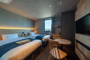 Voodi või voodid majutusasutuse hotel around TAKAYAMA, Ascend Hotel Collection toas