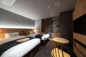 Voodi või voodid majutusasutuse hotel around TAKAYAMA, Ascend Hotel Collection toas