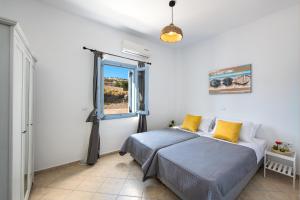 Katil atau katil-katil dalam bilik di Terra Vecchia Suites