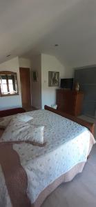 A bed or beds in a room at Hostal Casa Martinez