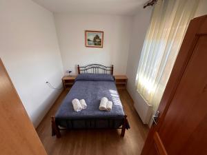 Postel nebo postele na pokoji v ubytování Apartments Šuster