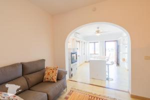 a living room with a couch and a table at Casa Horizonte in Moraira