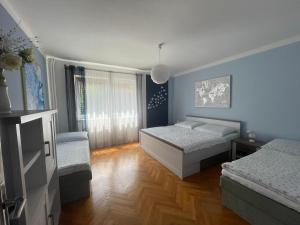 Postel nebo postele na pokoji v ubytování apartman pro 4 osoby