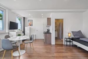 Posezení v ubytování RO01 Schickes 1-Zimmer Apartment + 3 fotografie