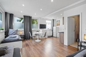 TV a/nebo společenská místnost v ubytování RO01 Schickes 1-Zimmer Apartment