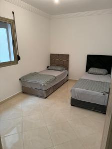 Giường trong phòng chung tại Appartement de luxe