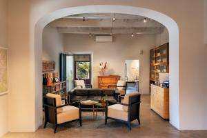 an archway in a room with chairs and a living room at Podere Castellare in Pelago +85 photos