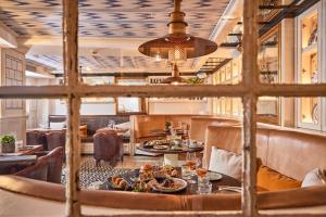 a restaurant with a table with food on it at Hotel Cort in Palma de Mallorca