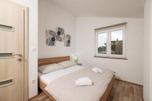 Postel nebo postele na pokoji v ubytování Apartments Anita