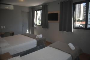 Llit o llits en una habitació de Unity Hotel - Vila Mariana SP