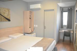 Llit o llits en una habitació de Unity Hotel - Vila Mariana SP