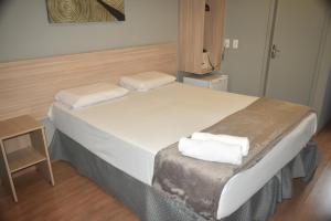 Llit o llits en una habitació de Unity Hotel - Vila Mariana SP