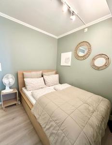 En eller flere senge i et værelse på Apartment «Ladegården» in Bergen