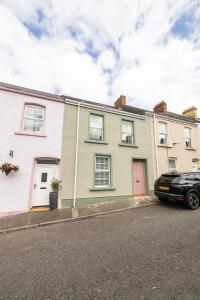 a black car parked in front of a house at Primrose in Derry Londonderry