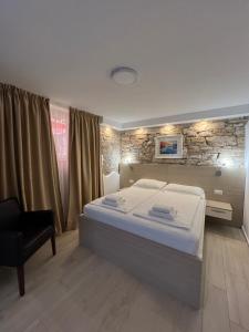 Postel nebo postele na pokoji v ubytování Minella Residence