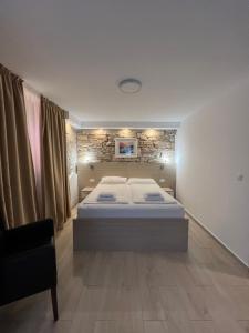Postel nebo postele na pokoji v ubytování Minella Residence