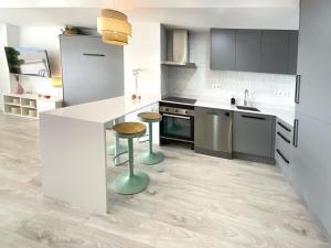 A kitchen or kitchenette at CS7 Kaleria Suites