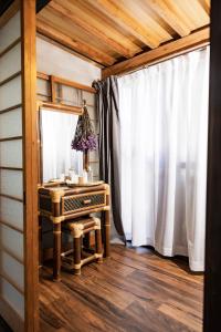 a dressing room with a mirror and a dressing table at Holiday cottage BEPPU ICHIYA in Beppu +52 photos