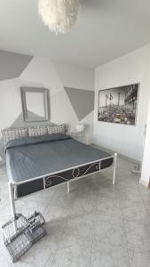 a large bed in a room with at MarMolí in Villanova dʼAsti