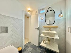a bathroom with a sink and a mirror at Private Alentejo house with a terrace in Évora