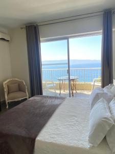 Postel nebo postele na pokoji v ubytování Sun Beach