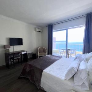 Postel nebo postele na pokoji v ubytování Sun Beach